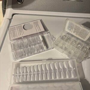 Three boxes of nail tips